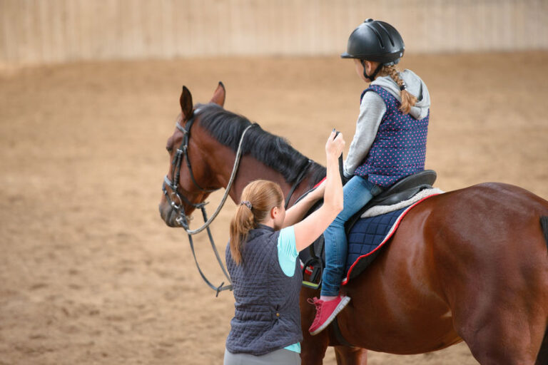 Child horseback riding at Little Dude Ranch horse camp