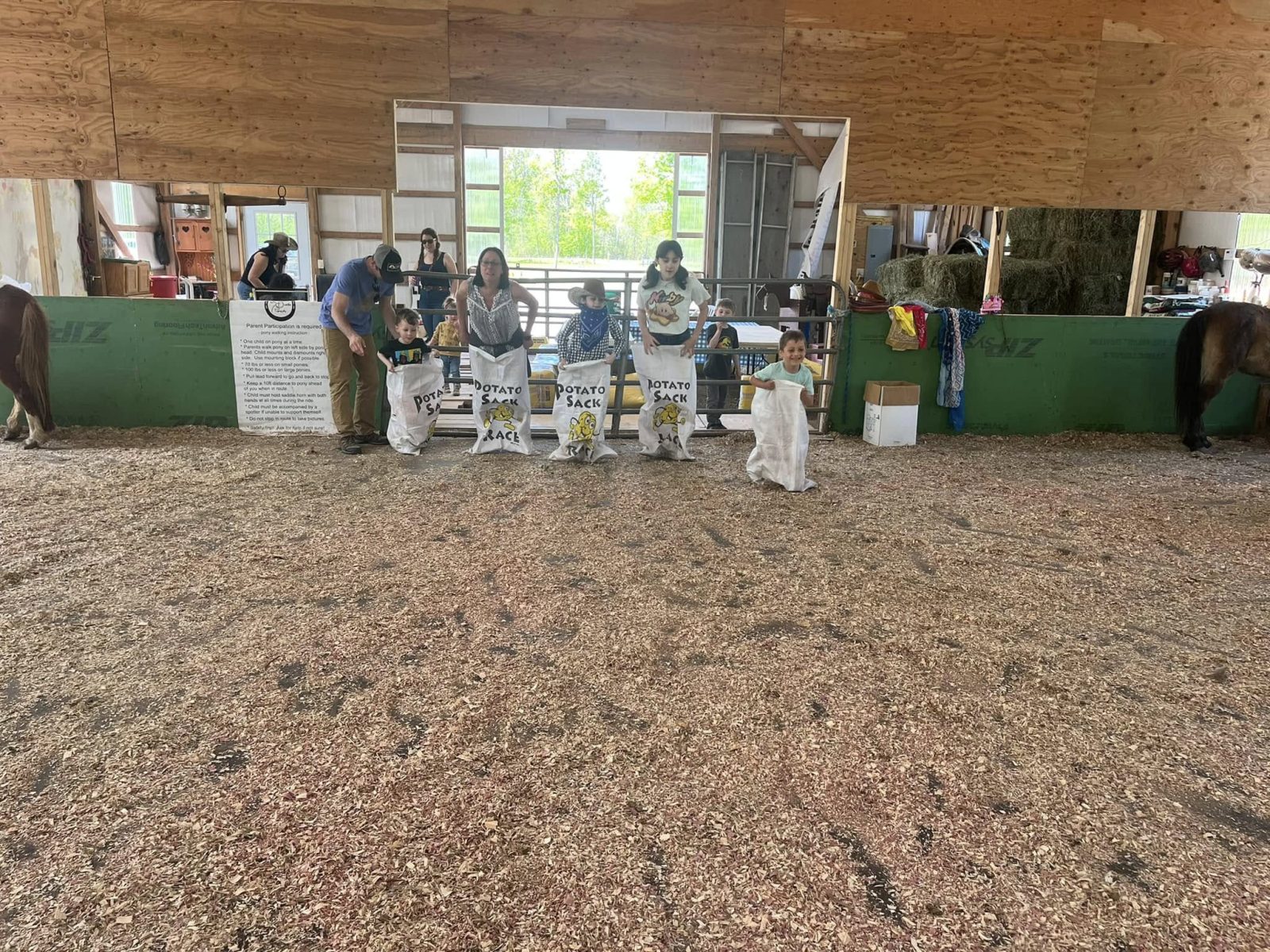 Children playing outdoor games at Little Dude Ranch horse camp